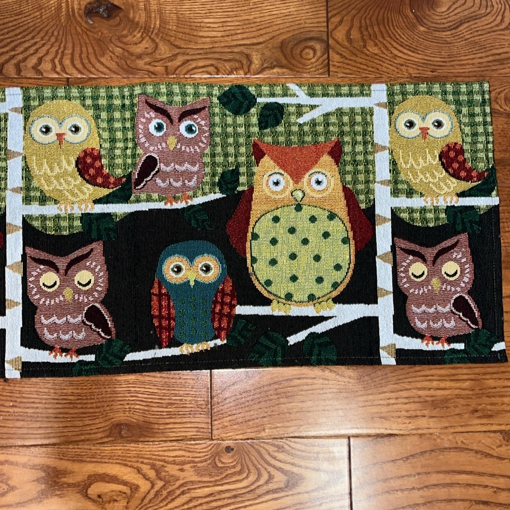 Owl tapestry table runner with 5 different owls sitting on a tree branch